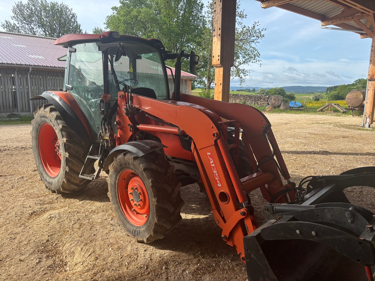 Tracteur chargeur KUBOTA M 8560 DTHQ - photo slide 1