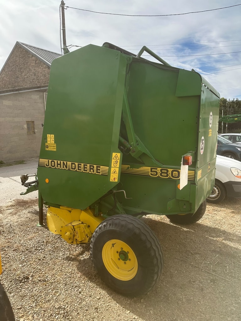 Presse balles rondes JOHN DEERE 580 - photo slide 4