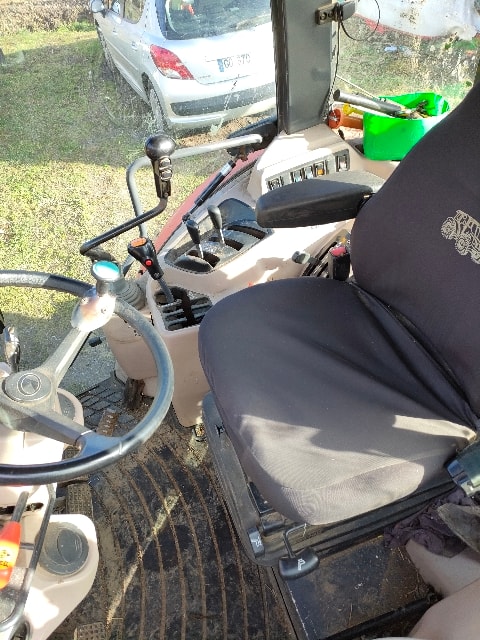 Tracteur chargeur KUBOTA M8560 - photo slide 11